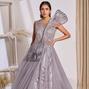 Wear to be confident. Lilac Purple Net Cutdana Worked Gown